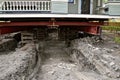 Old house resting on girders and timbers Royalty Free Stock Photo