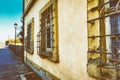 Old house with sandstone facade and barred windows Royalty Free Stock Photo