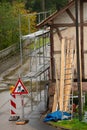 Old house with scaffolding, renovating the home, painting the facade, insulation of the wall Royalty Free Stock Photo