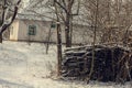 Old house with snowed wattle fence landscape photo Royalty Free Stock Photo