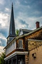 An old house and steeple of a chuch in Ellicott City, Maryland. Royalty Free Stock Photo