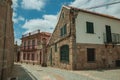 Old house with stone wall on deserted alley Royalty Free Stock Photo