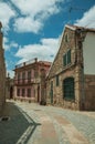 Old house with stone wall on deserted alley Royalty Free Stock Photo