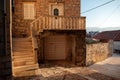 Old house on street paved with tiles and cobblestones Royalty Free Stock Photo