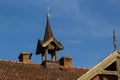 Old house with tile roof on the background of the sky. Texture, roof repair in vintage style Royalty Free Stock Photo