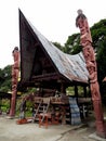 Old house with two totens in Huta Siallagan Ancient Batak Village on Lake Toba, Pulau Samosir. Indonesia