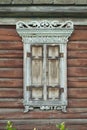 Old house vintage carved windows with wooden lacy shutters close up Royalty Free Stock Photo