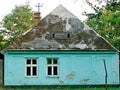 Old house in Vojlovica, Vojvodina, Serbia. Turquoise wall. Tired. Old. Family living.