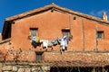Old house with washed clothes hanging on ropes hanging from the windows Royalty Free Stock Photo