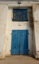 Old worn door window blue white wall wallpapper house ibiza Royalty Free Stock Photo