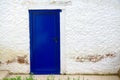 Old house white wall with new blue door Royalty Free Stock Photo