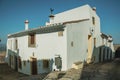 Old house with whitewashed wall in an alley of Marvao