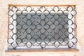 Old window with decorative iron gratings with decorative details Royalty Free Stock Photo