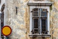 Old house, window and traffic sign