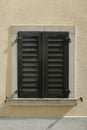 Old house window with weathered wooden shutters. Close up shot, no people, Europe Royalty Free Stock Photo