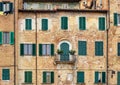 Old house with windows with wooden shutters in Siena. Italy Royalty Free Stock Photo