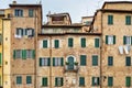 Old house with windows with wooden shutters in Siena. Italy Royalty Free Stock Photo