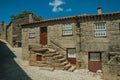 Old house with wooden door and staircase on alley Royalty Free Stock Photo