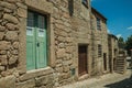 Old house with wooden door and staircase on alley Royalty Free Stock Photo