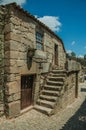 Old house with wooden door and staircase on alley Royalty Free Stock Photo