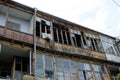 Old house with wooden loggias and broken glass.