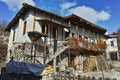 Old house with wooden porch in village of Rozhen, Bulgaria