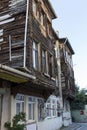 Old house with a wooden second floor. Historical ruined architecture of the Ottoman period. Side view