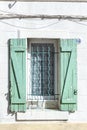 Old house with wooden window shutter and peeling paint Royalty Free Stock Photo