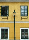 Old house yellow wall and street lantern in Grinzing Royalty Free Stock Photo
