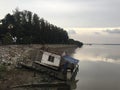 An old houseboat washed ashore Royalty Free Stock Photo