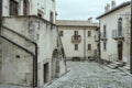 Old houses on cobbled uphill street, Pescocostanzo, Abruzzo, Italy