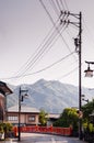 Old houses and Japanese red bridge street and mountain view of H