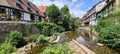 Old houses lining the river banks in Kaysersberg-Vignoble in Alsace, France Royalty Free Stock Photo