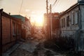 Old houses on low-rise street in old poverty part of Voronezh city in Russia in sunset