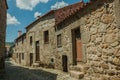 Old houses made of stone on cobblestone alley