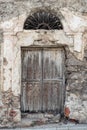 Old wooden door. House made of stones, wood, in Oliena, Nuoro, Sardinia, Italy, Europa