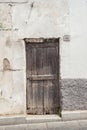 Old wooden door. House made of stones, wood, in Oliena, Nuoro, Sardinia, Italy, Europa