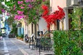 Old houses in the narrow streets of Nafplion town with Bougainvillea flowers