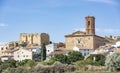 Old houses and the Santa Cruz parish church in Plou Royalty Free Stock Photo