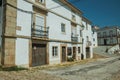 Old houses on street and deserted alley coming out on slope