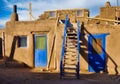 Old houses under the sunlight and a blue cloudy sky in Taos Pueblo, New Mexico Royalty Free Stock Photo