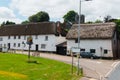 Old houses under thatched roof in the city of Crediton, Devon, United Kingdom June 2, 2018 Royalty Free Stock Photo
