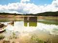 Old houses of a village in the Sau Reservoir in Catalonia during the drought. Drought in Spain, environmental problems.