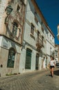 Old houses and woman walking down the street