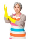 Old housewife wear with plastic gloves Royalty Free Stock Photo