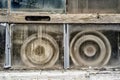 Old hubcaps in a dirty window Royalty Free Stock Photo