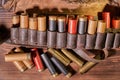 Old hunting cartridges and bandoleer on a wooden table