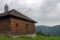 Old hunting wooden cottage in Jeseniky mountains on a summer cloudy day
