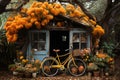 an old hut or barn on the background of beautiful autumn nature, decorated with flowers and old things with a bicycle at the Royalty Free Stock Photo