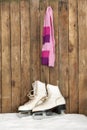 Old ice skates and scarf in the snow Royalty Free Stock Photo